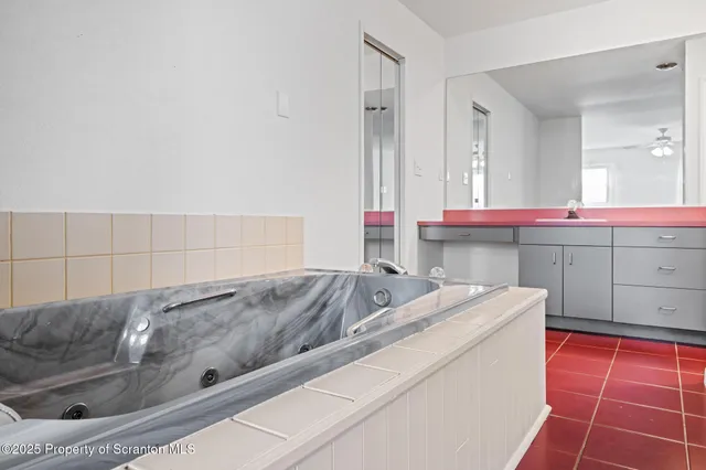 a living room with a couch and a stove top oven