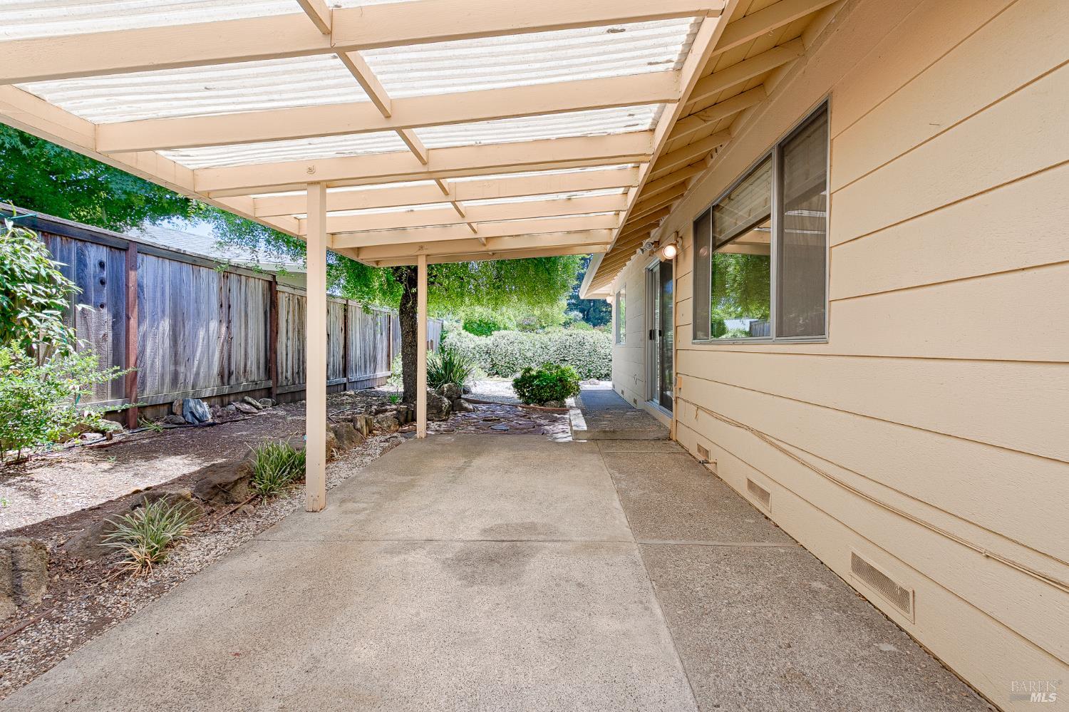 138 Oak Shadow Drive Santa Rosa, CA 95409 - Photo 50 of 50 a view of a backyard with plants and a patio