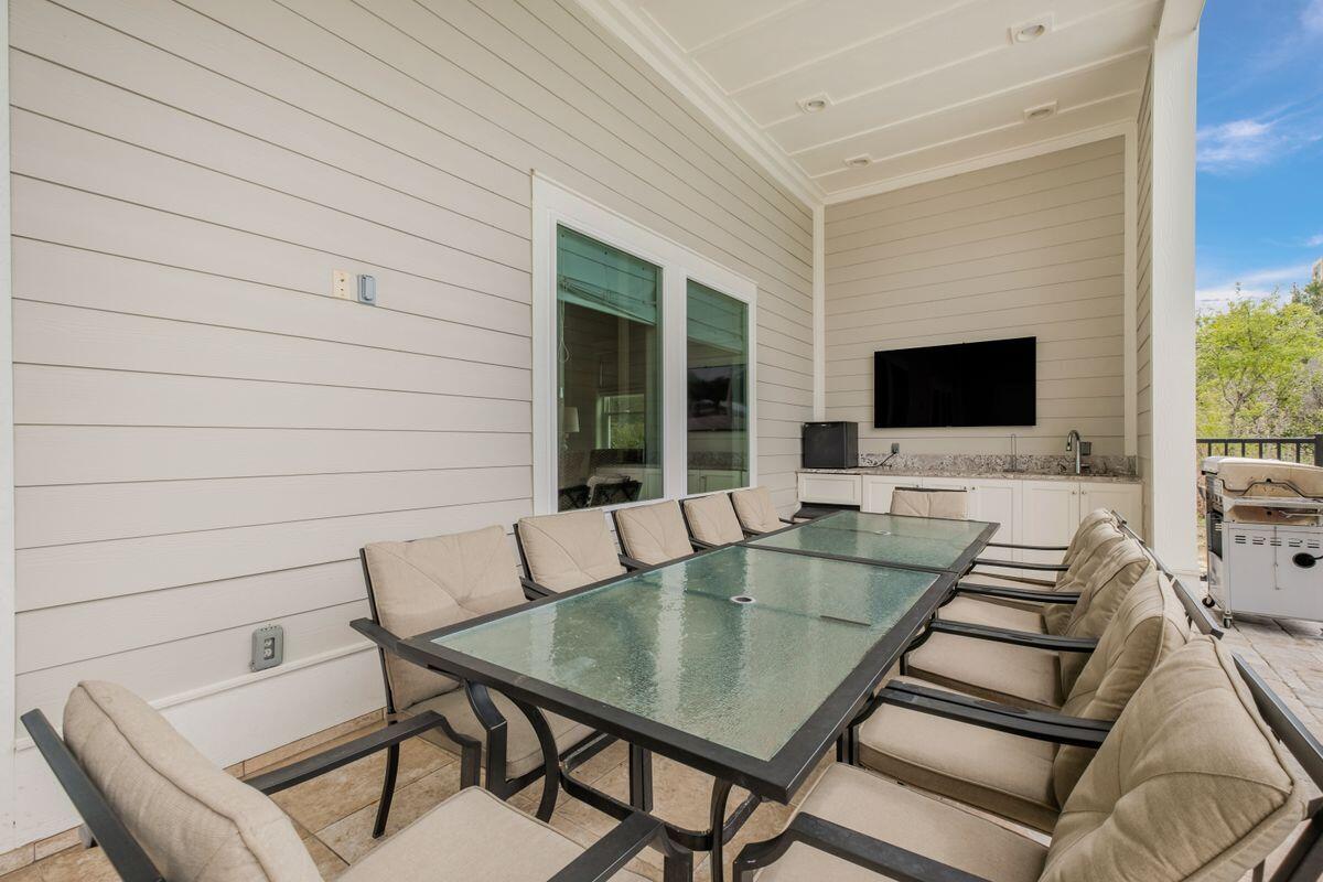 240 Overlook Drive Miramar Beach, FL 32550 - Photo 15 of 47 a view of table and chairs in patio