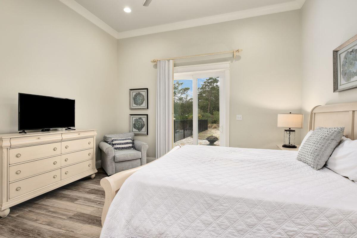 240 Overlook Drive Miramar Beach, FL 32550 - Photo 18 of 47 a bedroom with a bed and a flat screen tv