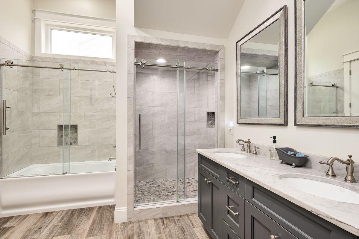 240 Overlook Drive Miramar Beach, FL 32550 - Photo 19 of 47 a bathroom with a granite countertop sink mirror bathtub and shower