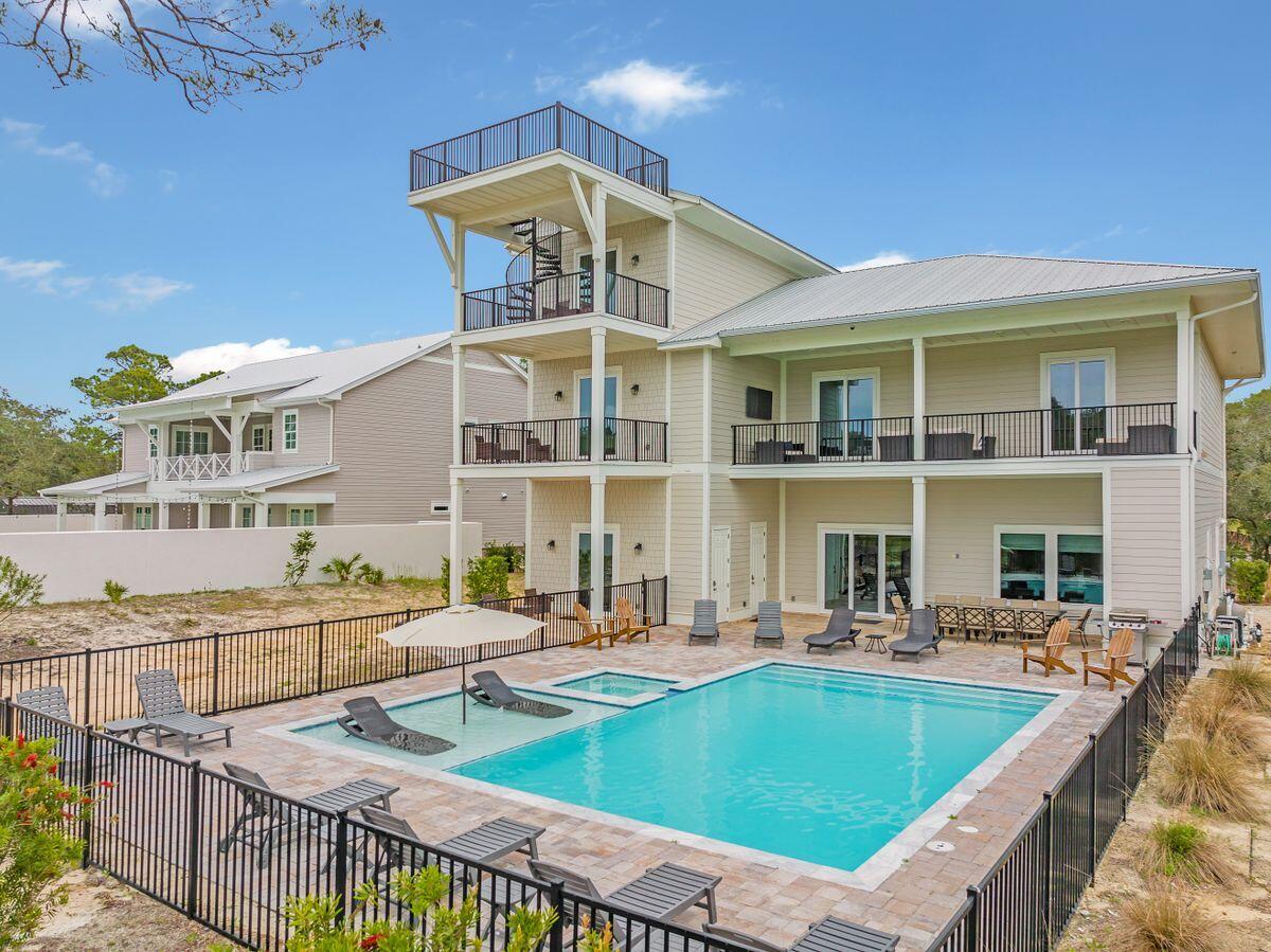 240 Overlook Drive Miramar Beach, FL 32550 - Photo 2 of 47 a view of a patio with swimming pool