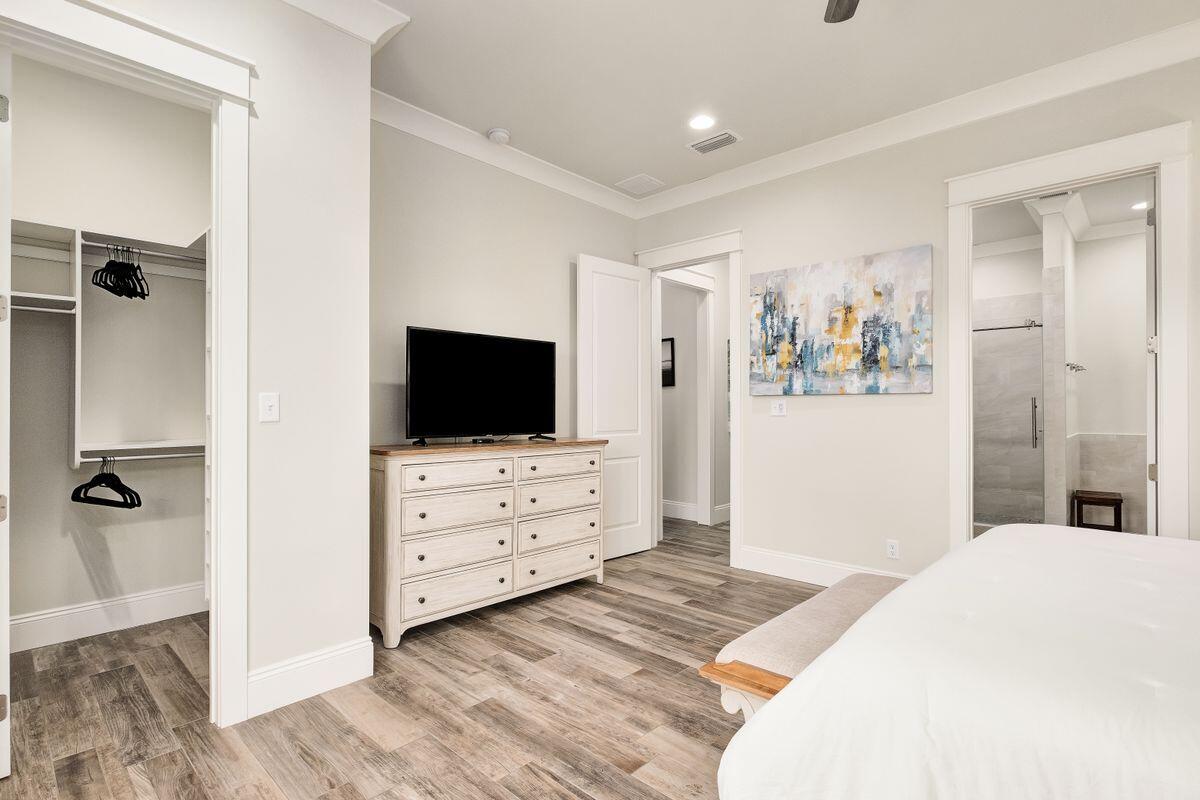 240 Overlook Drive Miramar Beach, FL 32550 - Photo 24 of 47 a bedroom with a bed and a flat screen tv