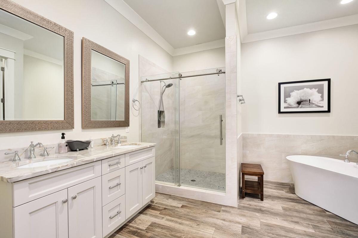 240 Overlook Drive Miramar Beach, FL 32550 - Photo 25 of 47 a spacious bathroom with a double vanity sink a large mirror and a shower