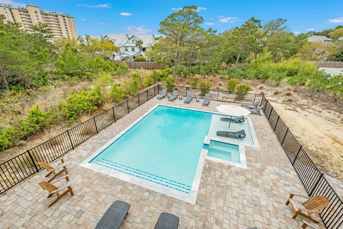 240 Overlook Drive Miramar Beach, FL 32550 - Photo 28 of 47 a view of a swimming pool with a lounge chairs