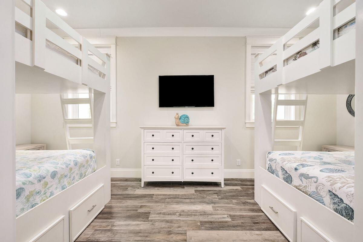 240 Overlook Drive Miramar Beach, FL 32550 - Photo 30 of 47 a spacious bedroom with a bed and a flat screen television