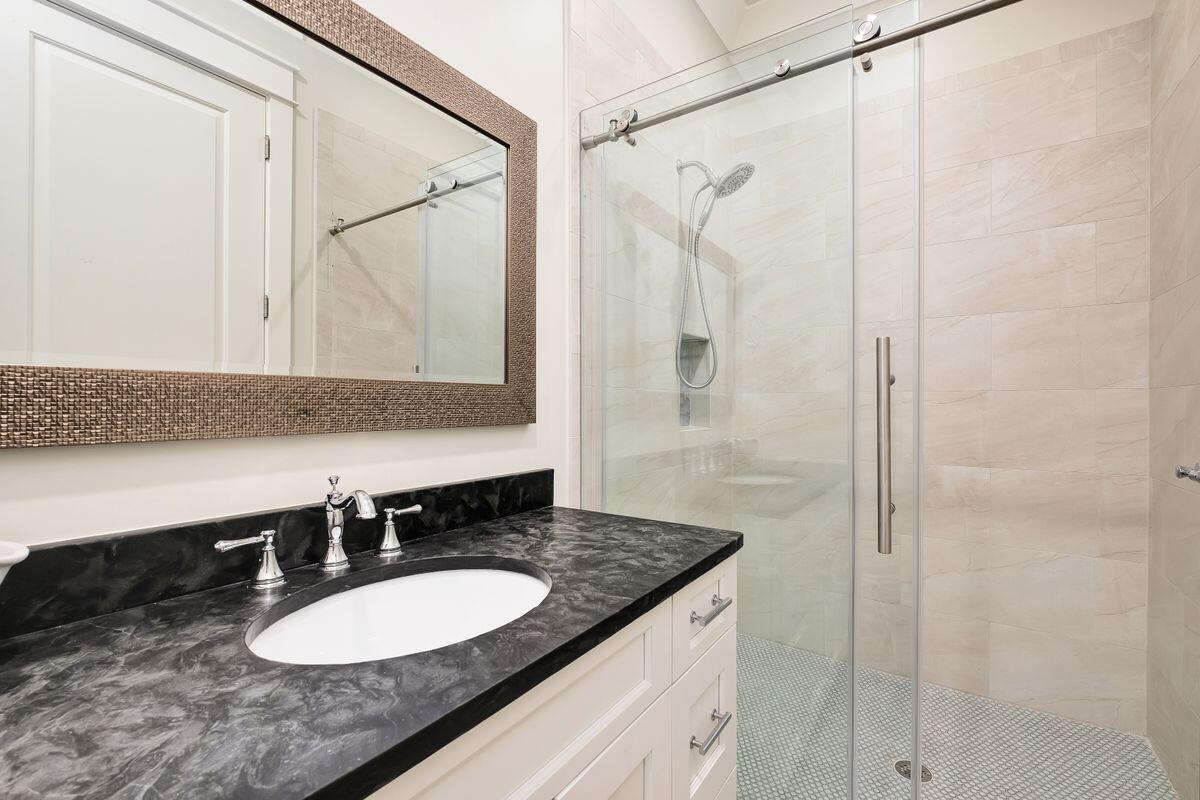 240 Overlook Drive Miramar Beach, FL 32550 - Photo 39 of 47 a bathroom with a granite countertop shower sink and mirror