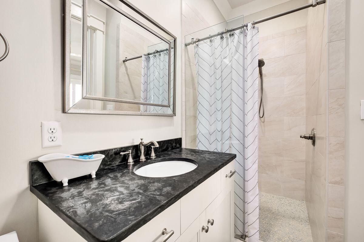 240 Overlook Drive Miramar Beach, FL 32550 - Photo 42 of 47 a bathroom with a granite countertop sink and a mirror