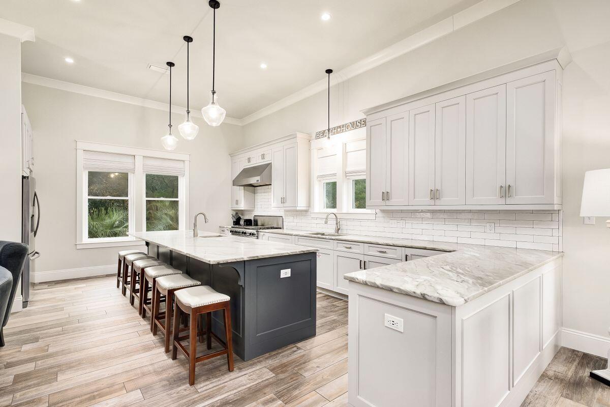 240 Overlook Drive Miramar Beach, FL 32550 - Photo 6 of 47 a kitchen with a sink stove and cabinets
