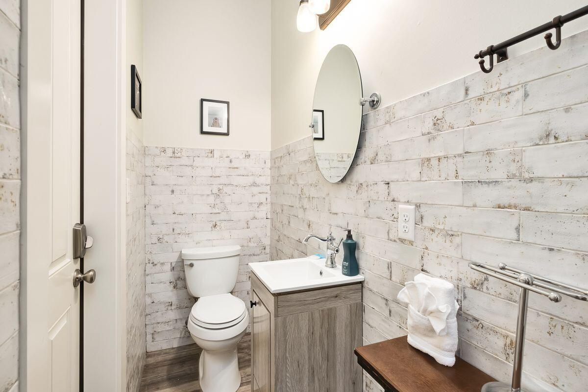 240 Overlook Drive Miramar Beach, FL 32550 - Photo 10 of 47 a white toilet sitting next to a bathroom sink