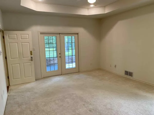a view of an empty room with a window