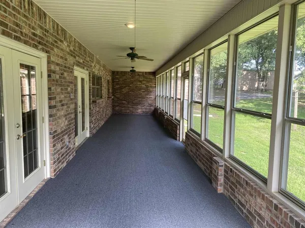 a view of a hallway with windows