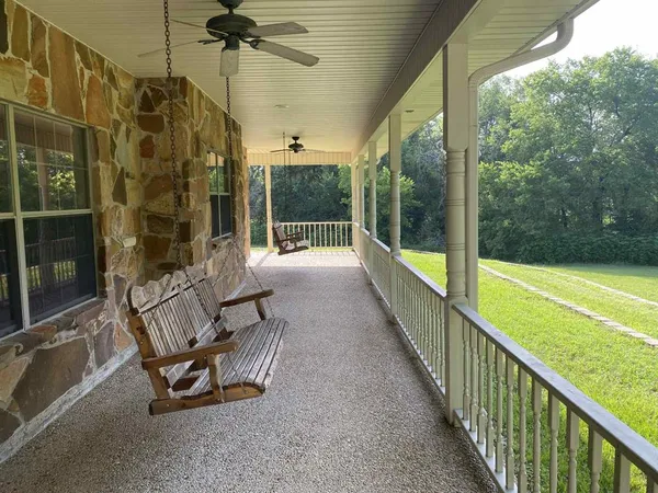 a view of a two chairs in the balcony