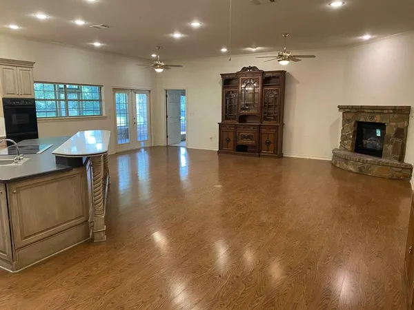 a view of a kitchen with furniture and a flat screen tv