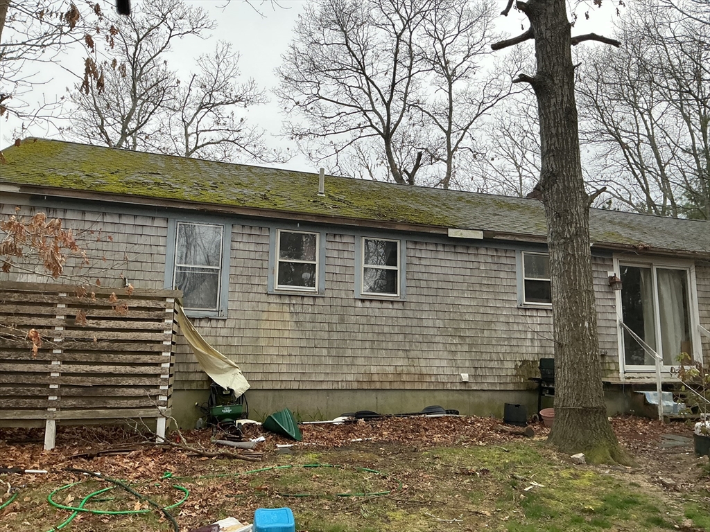 4 Blackthorn Path Sandwich, MA 02644 - Photo 2 of 5 a view of brick house with a yard