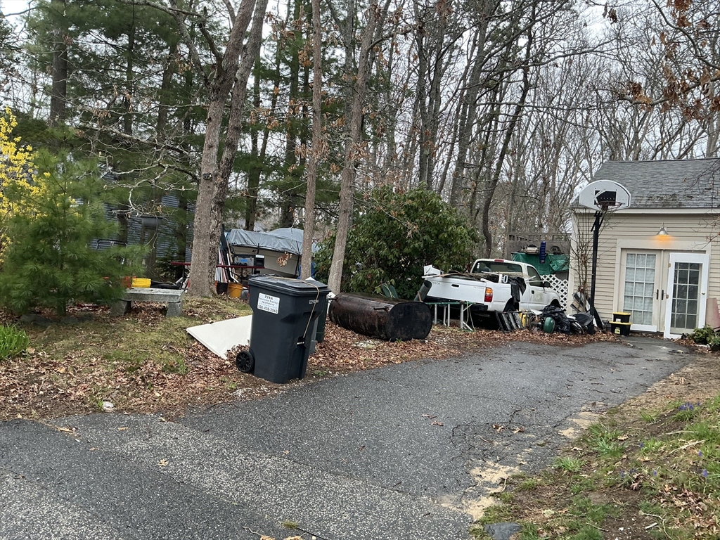 4 Blackthorn Path Sandwich, MA 02644 - Photo 4 of 5 a view of a backyard with table and chairs
