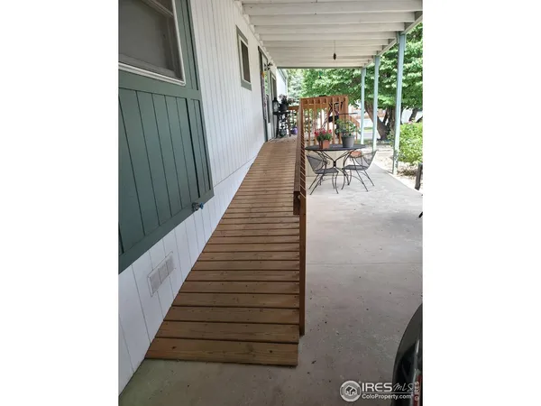 a view of a living room with furniture and a porch