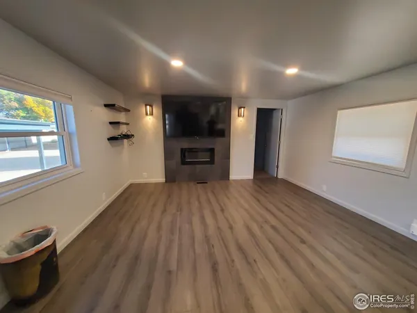 a view of a livingroom with a kitchen