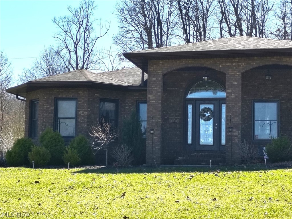 10174 Veto Road Belpre, OH 45714 - Photo 3 of 45 View of front facade and roof.