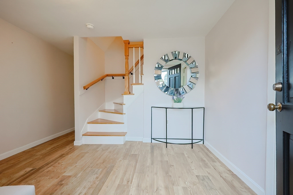 23 Pine Ridge Circle Reading, MA 01867 - Photo 5 of 42 wooden floor & ceiling fan in a room