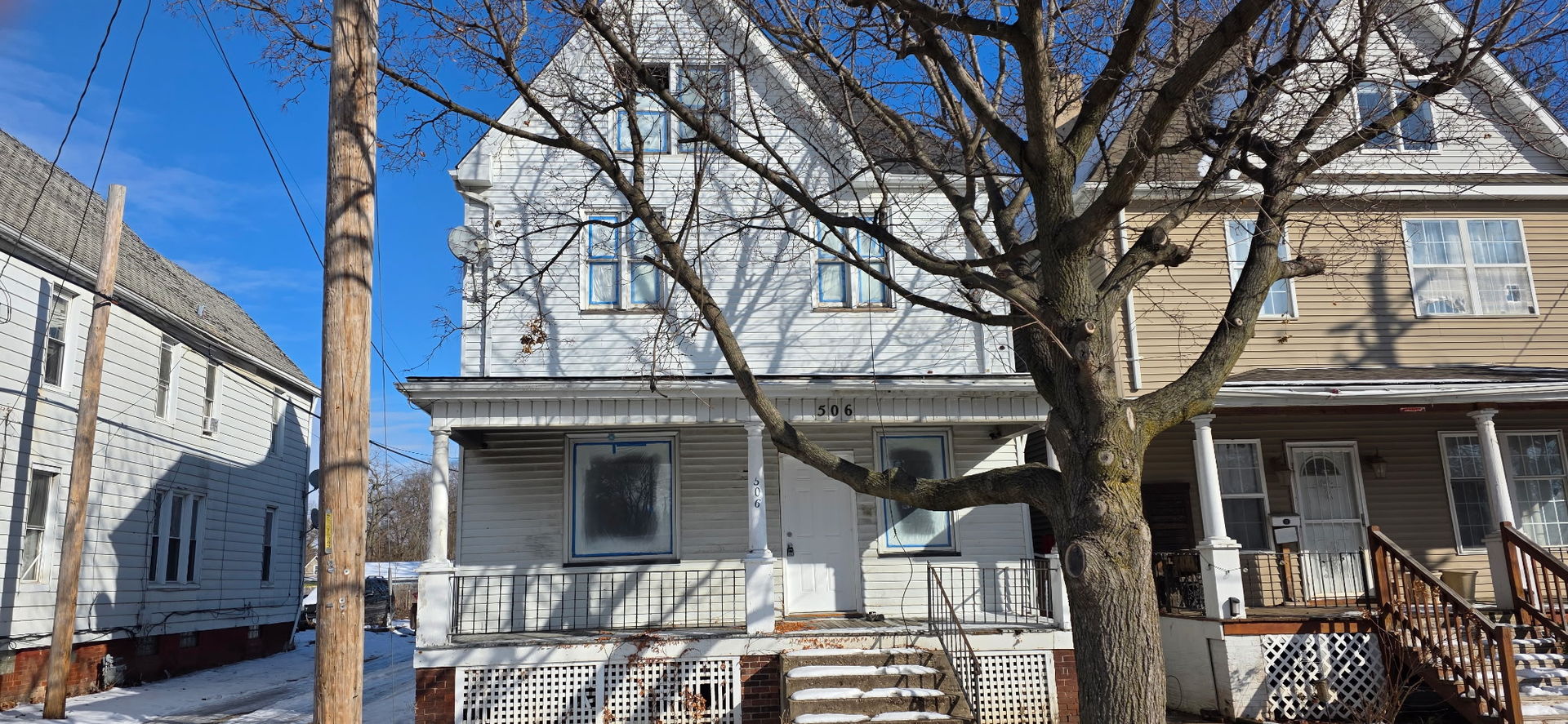 a view of a house with a tree