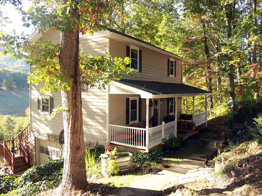 185 Loop Road Clyde, NC 28721 - Photo 1 of 24 a view of a house with a yard