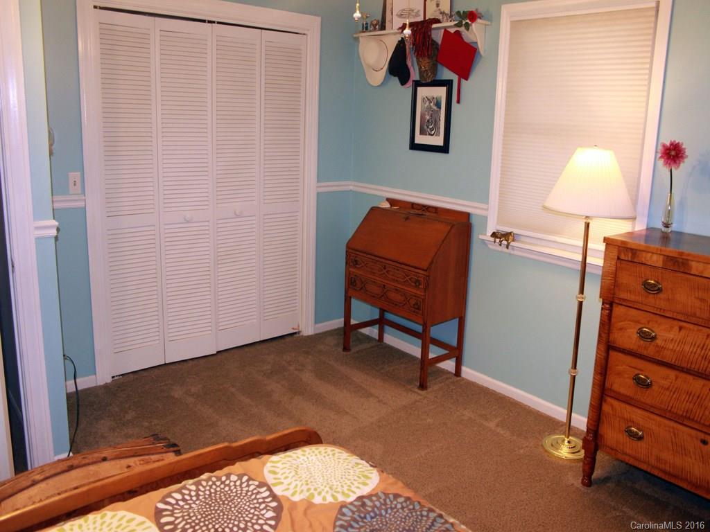 185 Loop Road Clyde, NC 28721 - Photo 11 of 24 a view of a workspace with furniture and a window