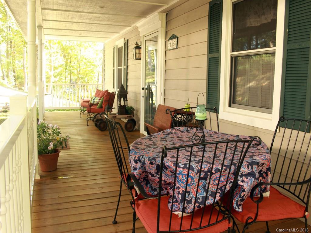 185 Loop Road Clyde, NC 28721 - Photo 19 of 24 a view of a dining room with furniture window and outside view