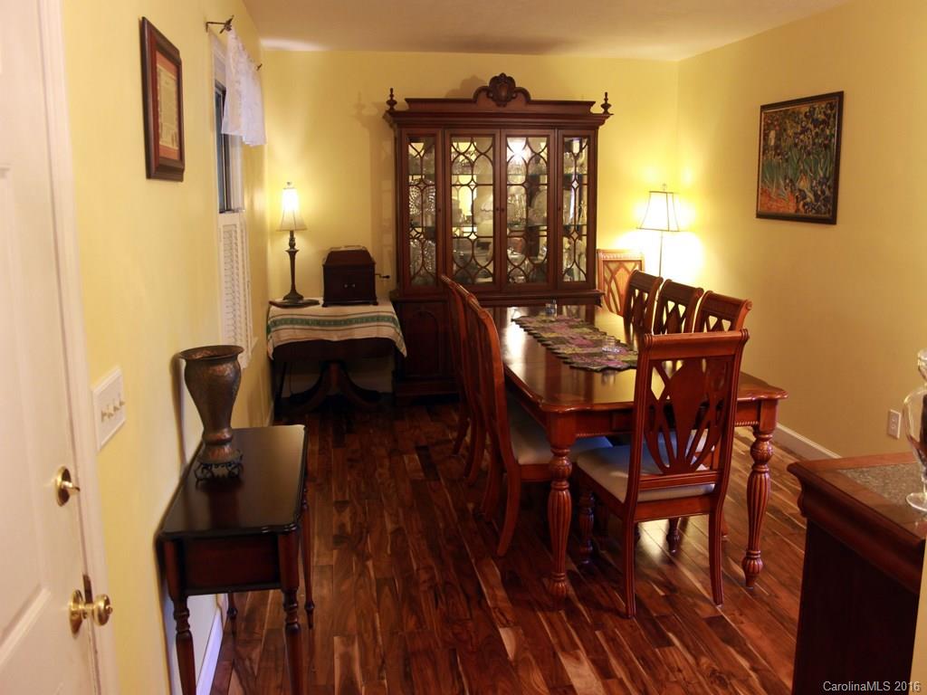 185 Loop Road Clyde, NC 28721 - Photo 3 of 24 a view of a dining room with furniture and window