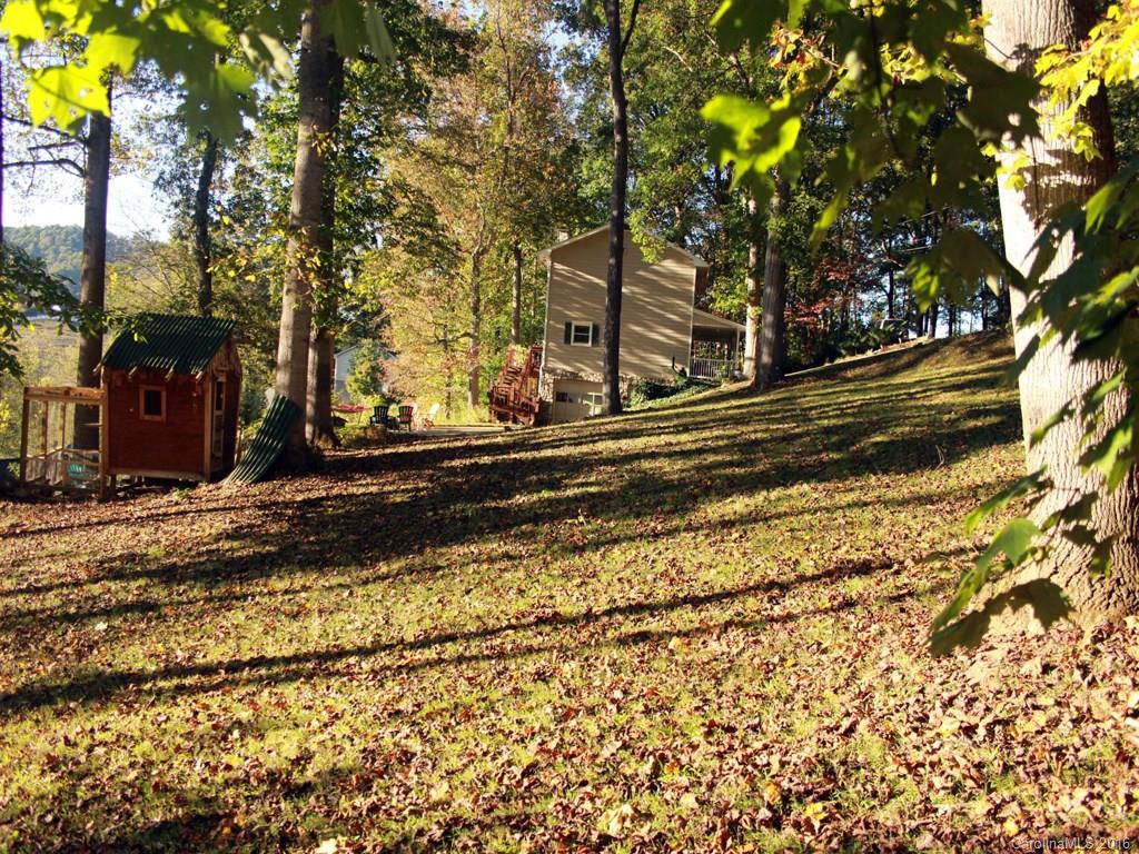 185 Loop Road Clyde, NC 28721 - Photo 22 of 24 a backyard of a house with lots of green space