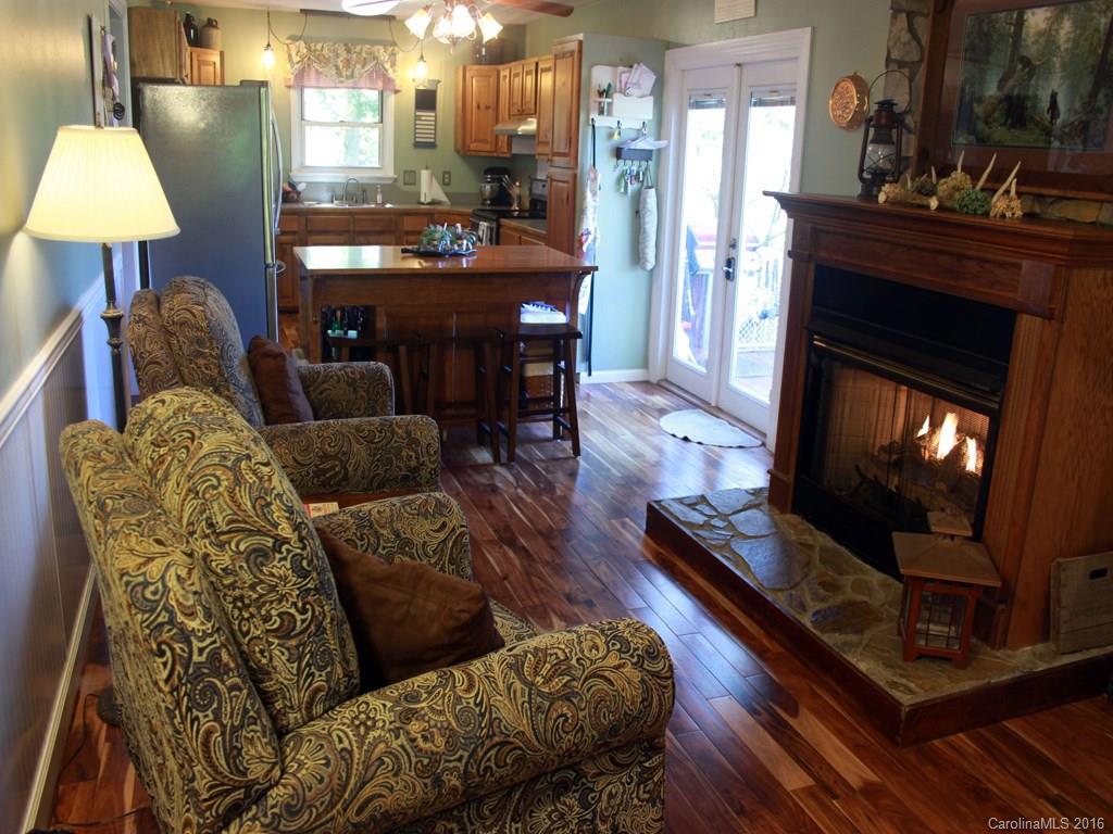 185 Loop Road Clyde, NC 28721 - Photo 4 of 24 a living room with furniture and a fireplace