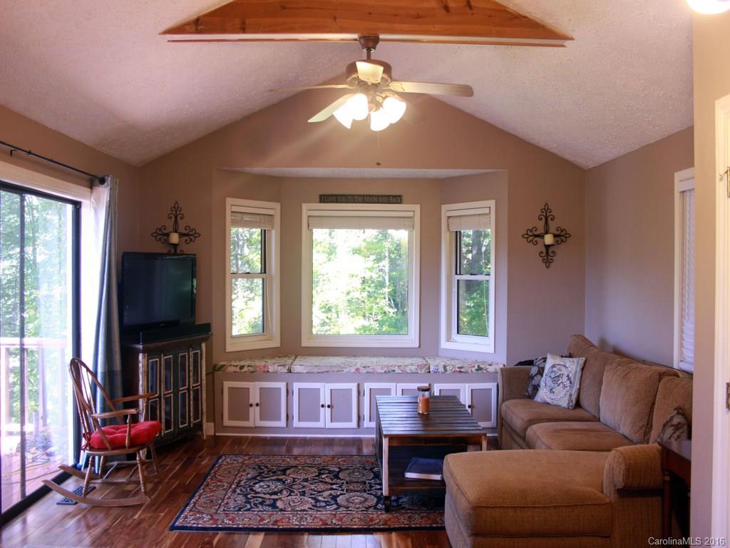 185 Loop Road Clyde, NC 28721 - Photo 5 of 24 a living room with furniture and a flat screen tv