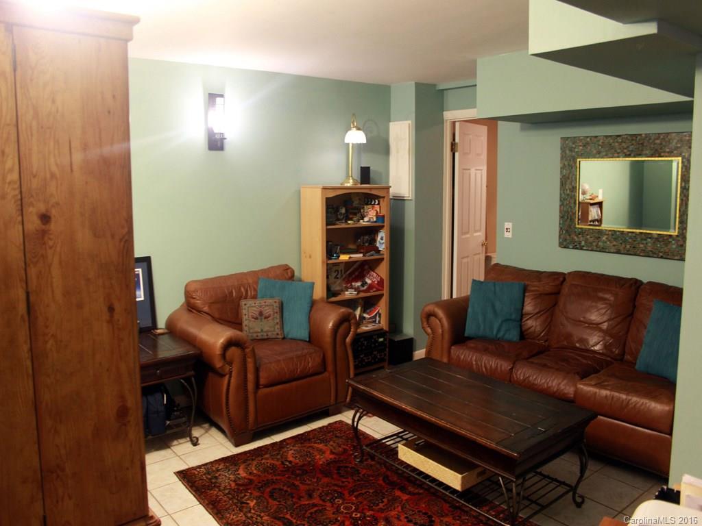 185 Loop Road Clyde, NC 28721 - Photo 7 of 24 a living room with furniture and a couch