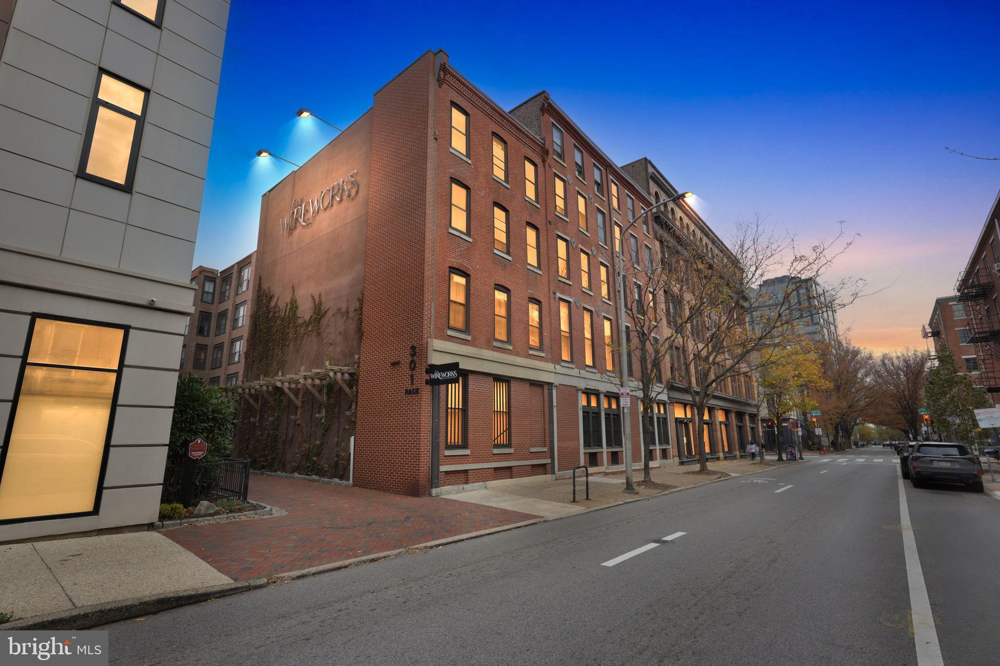 301 Race Street, Unit C010 Philadelphia, PA 19106 - Photo 2 of 27 a city street lined with tall buildings