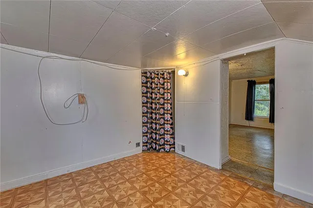 a view of empty room with windows