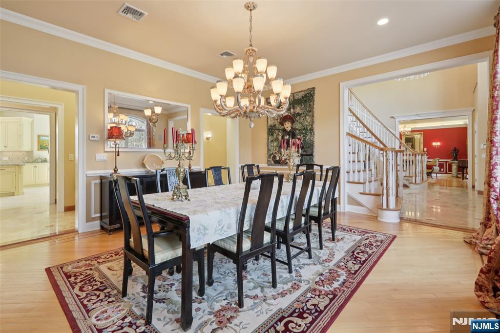 14 Werimus Brook Road Saddle River, NJ 07458 - Photo 17 of 50 a view of a dining room with furniture wooden floor and chandelier