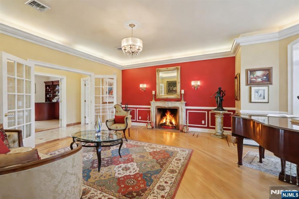 14 Werimus Brook Road Saddle River, NJ 07458 - Photo 20 of 50 a living room with furniture and a fireplace