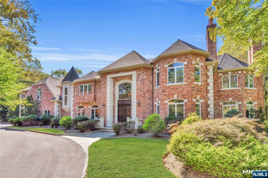 14 Werimus Brook Road Saddle River, NJ 07458 - Photo 2 of 50 a front view of a house with garden