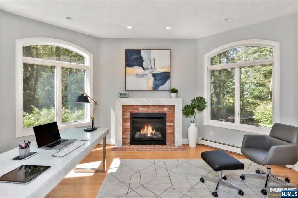 14 Werimus Brook Road Saddle River, NJ 07458 - Photo 23 of 50 a living room with furniture a window and a fireplace
