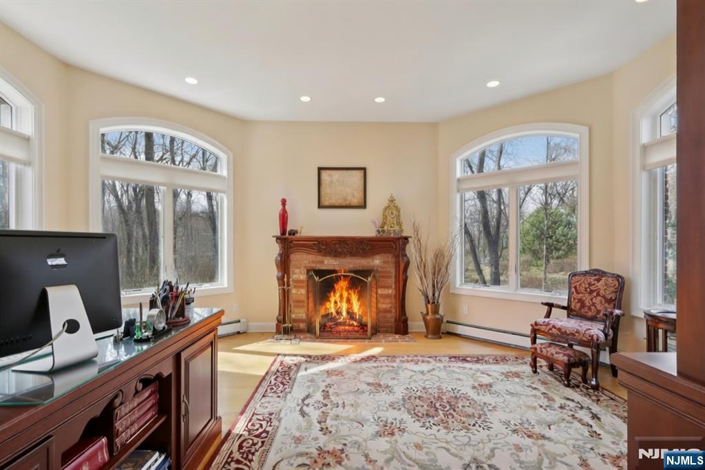 14 Werimus Brook Road Saddle River, NJ 07458 - Photo 24 of 50 a living room with furniture and a fireplace