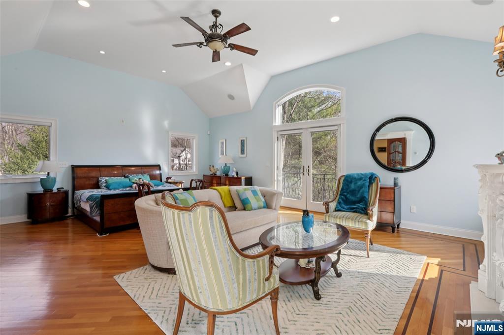 14 Werimus Brook Road Saddle River, NJ 07458 - Photo 31 of 50 a living room with furniture a rug a clock and a window