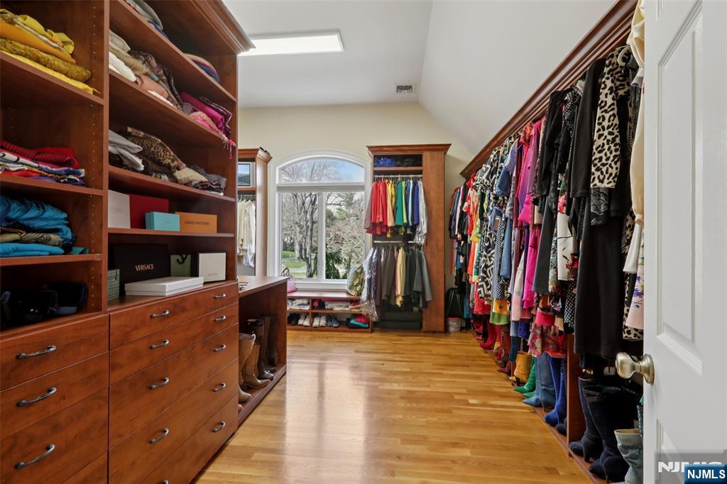 14 Werimus Brook Road Saddle River, NJ 07458 - Photo 33 of 50 a view of walk in closet with clothes and shoes