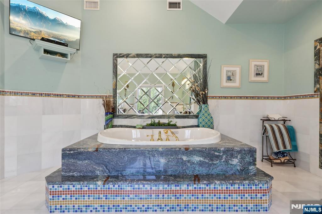 14 Werimus Brook Road Saddle River, NJ 07458 - Photo 34 of 50 a bathroom with a bathtub