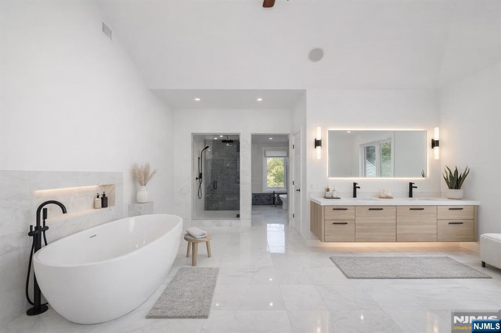 14 Werimus Brook Road Saddle River, NJ 07458 - Photo 36 of 50 a spacious bathroom with a bathtub and sink