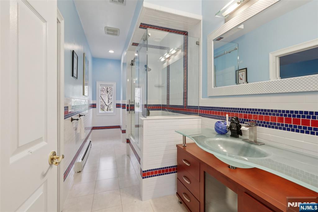 14 Werimus Brook Road Saddle River, NJ 07458 - Photo 44 of 50 a bathroom with a sink and a mirror