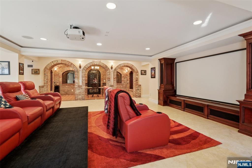 14 Werimus Brook Road Saddle River, NJ 07458 - Photo 46 of 50 a living room with furniture and a flat screen tv