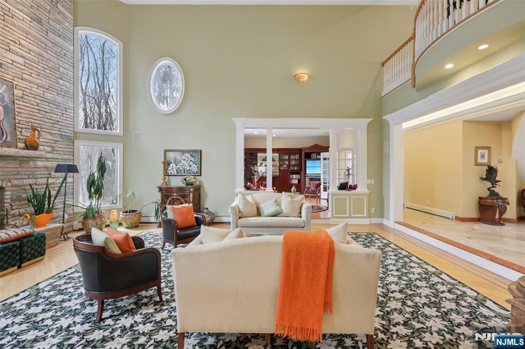 14 Werimus Brook Road Saddle River, NJ 07458 - Photo 8 of 50 a living room with fireplace furniture and a rug