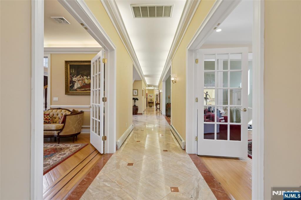 14 Werimus Brook Road Saddle River, NJ 07458 - Photo 9 of 50 a view of a hallway with living room and furniture