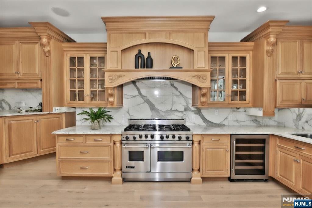 14 Werimus Brook Road Saddle River, NJ 07458 - Photo 10 of 50 a kitchen with granite countertop a stove top oven and cabinets