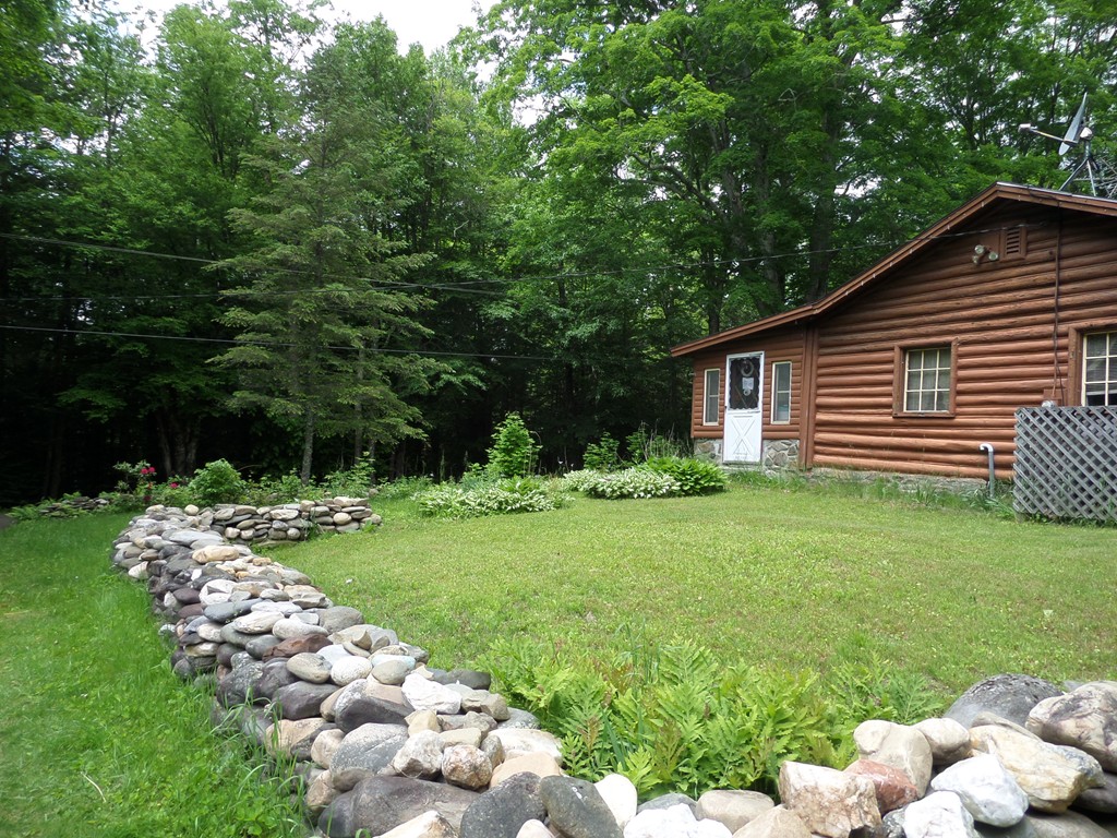 102 Fisk Road Worthington, MA 01098 - Photo 3 of 20 a front view of a house with garden